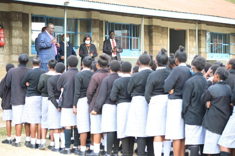 File image of students lining up to do KCSE exams.